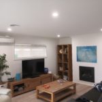 Residential electrician installs LED downlights