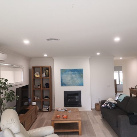 Residential electrician installs LED downlights